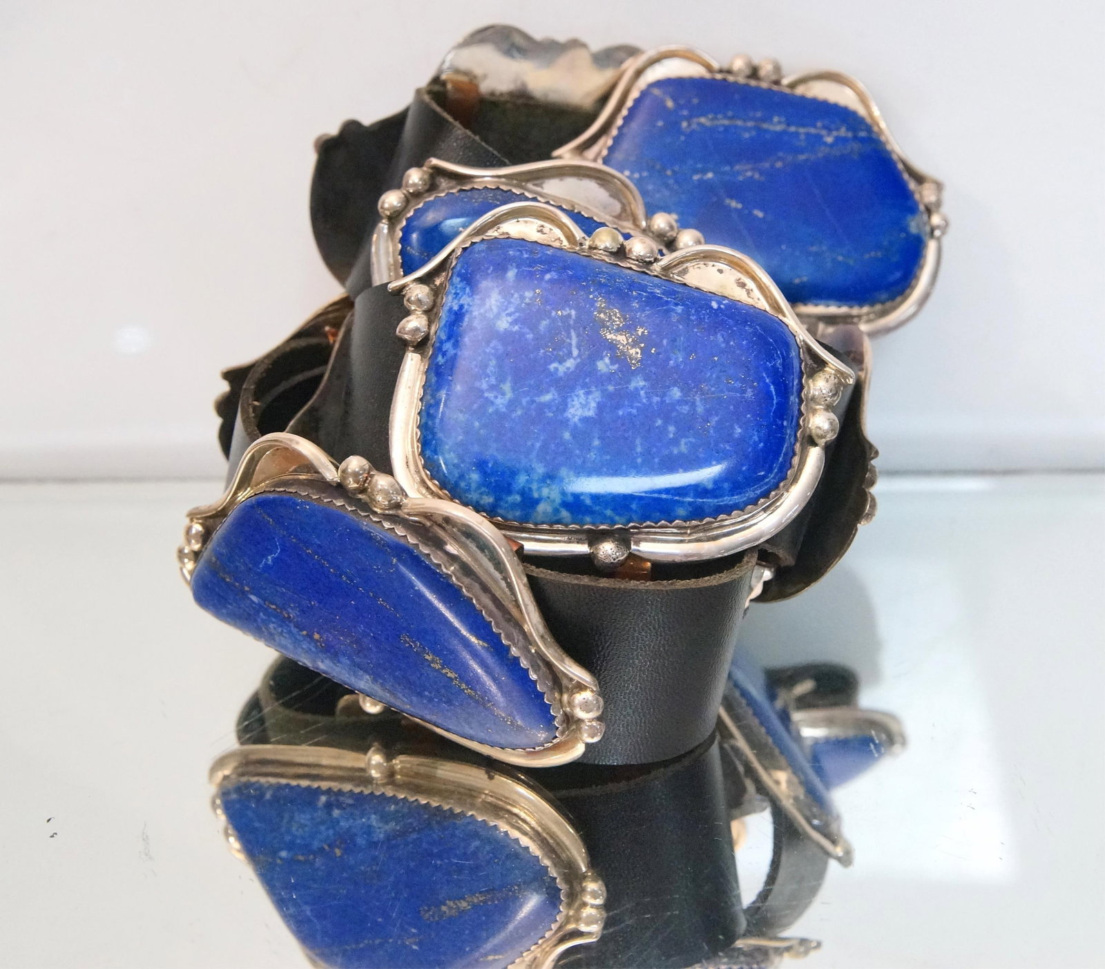 Ladies Navajo Sterling & Lapis Lazuli Concho Belt: Ladies Navajo Sterling & Lapis Lazuli Concho Belt 9 Lapis Lazuli conchos (including hallmarked buckle, marked R Sterling - probably Navajo Rex Abeita) each concho app 3" each - 35" belt with holes on 