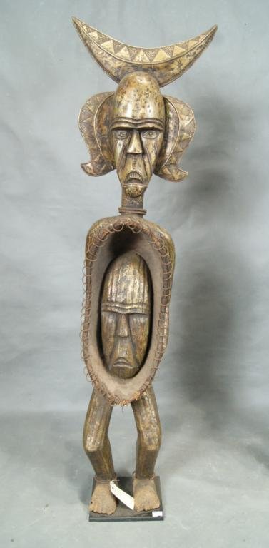 Brazzaville Congo Copper covered 71" Reliquary: standing at 71" with a mask stomach surrounded by rings; this life size statue was a focal point at Daniels Den. Kongo fetishes (nkisi) historically are used as public or private protectors/healers. t