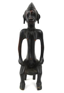 A West African Senufo Wood carved Female Figure: seated wood carved and brightly painted black female figure measures approx. 20.5" x 5.5" NO RESERVE