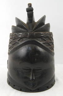 Antique Mende Liberia Bundu Mask Pre 1960's: Mende Dance headdress for women's initiation (Bundu Society) Blackened wood measures 13.5" x 9" x 8" Conical helmet mask representing head of a woman with an elaborate hair arrangement and small wide