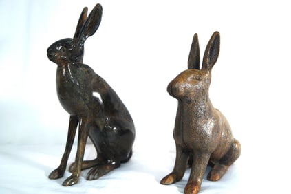 2 Cast iron antique rabbit door stops