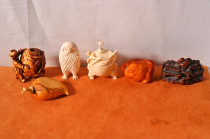 Collection of four antique Japanese carvings