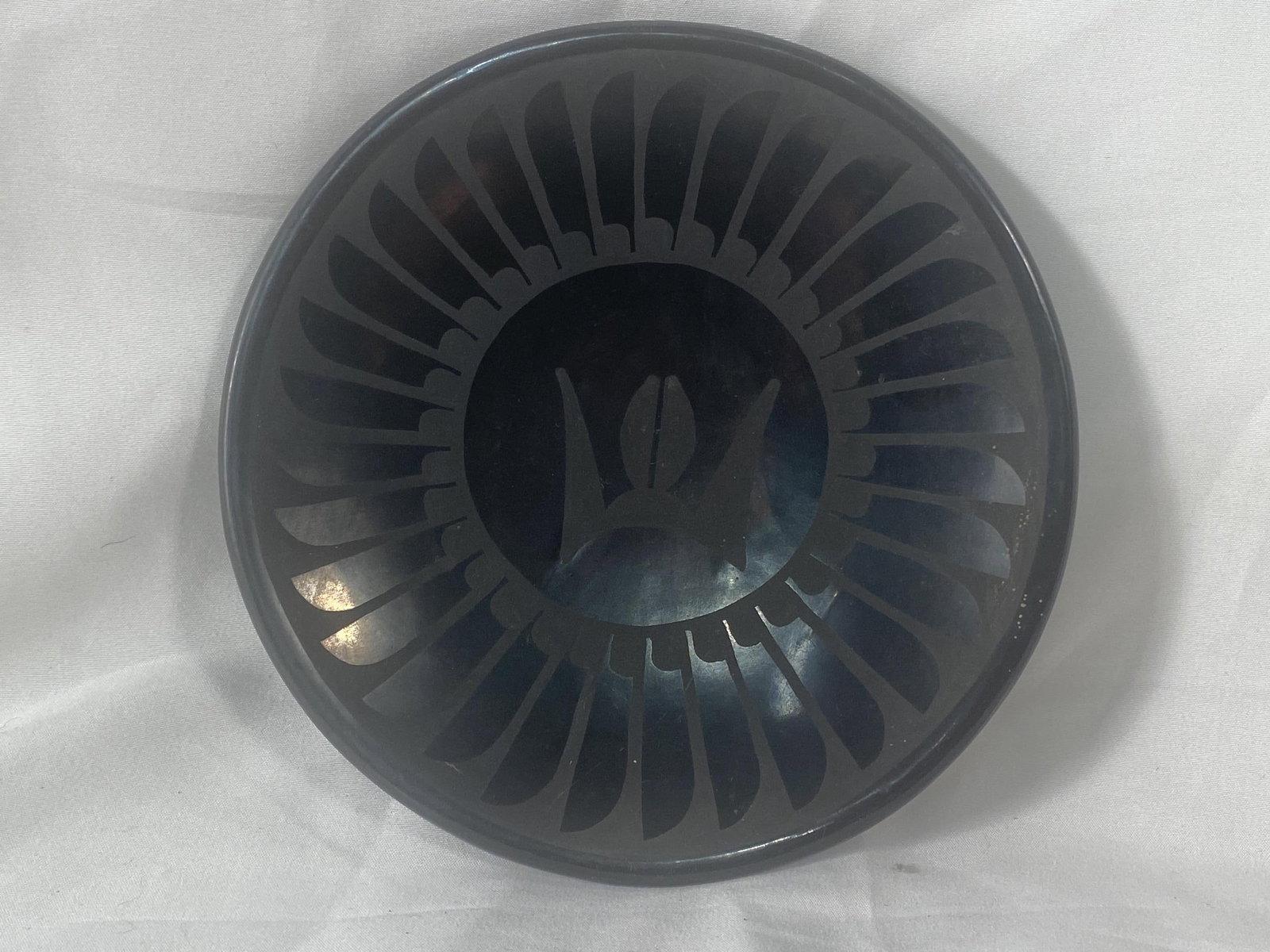 Maria Martinez (1887-1980) San Ildefonso plate: Maria Martinez (1887-1980) and Santana Martinez (1909-2002) - San Ildefonso Black on Black plate with Geometric Design c. 1940s, measures approximately 7 " x 1"- excellent condition, with very slight