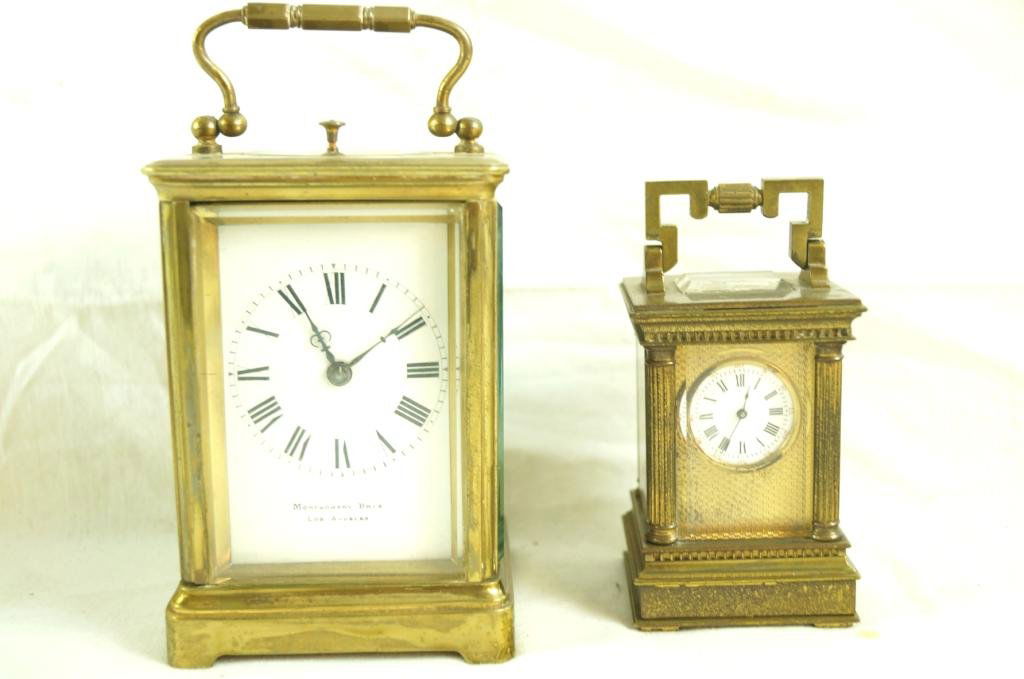 2 French Antique Brass Carriage clocks: Marked Montgomery Bros Los Angeles front and made in France in the rear. The smaller clock marked Depose and has the minutes marked in red around the roman numerals