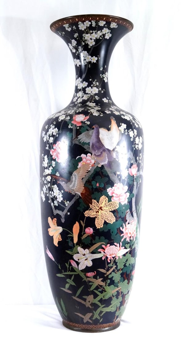 Monumental 19th C. Cloisonne Palace Vase: Meiji period to mid-20th century export, featuring intricate enamel work depicting doves, cherry blossom, various blooming flowers, including large pink peonies and chrysanthemums, set over a rare dar