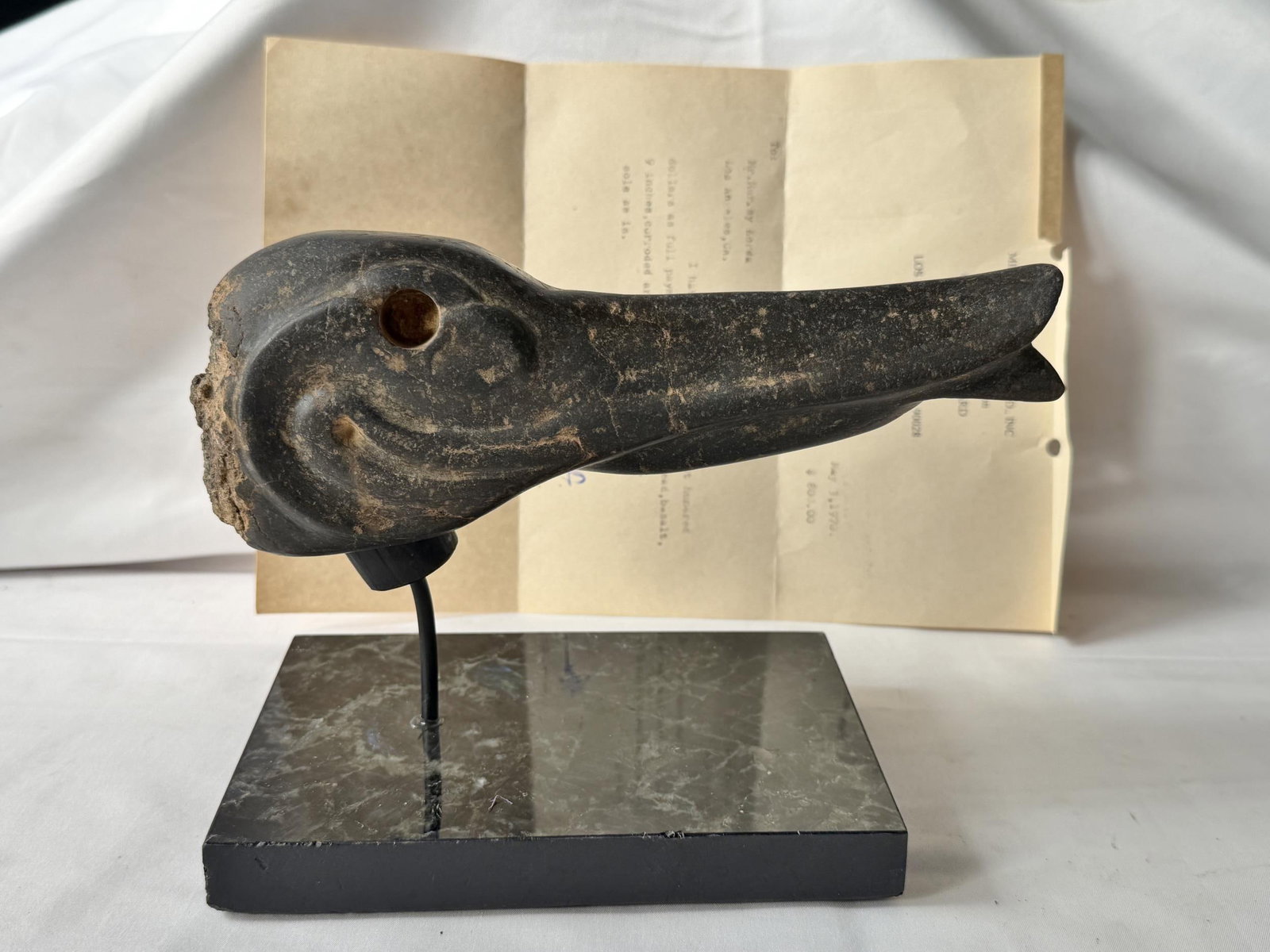 Olmec (1200-1800BC) Carved Basalt Pelican: Basalt Carved Pelican head with letter of sale from 1970 from Mesoamerican authority Milton Burnbaum M.D.. Measures approx. 9" and includes marble plinth