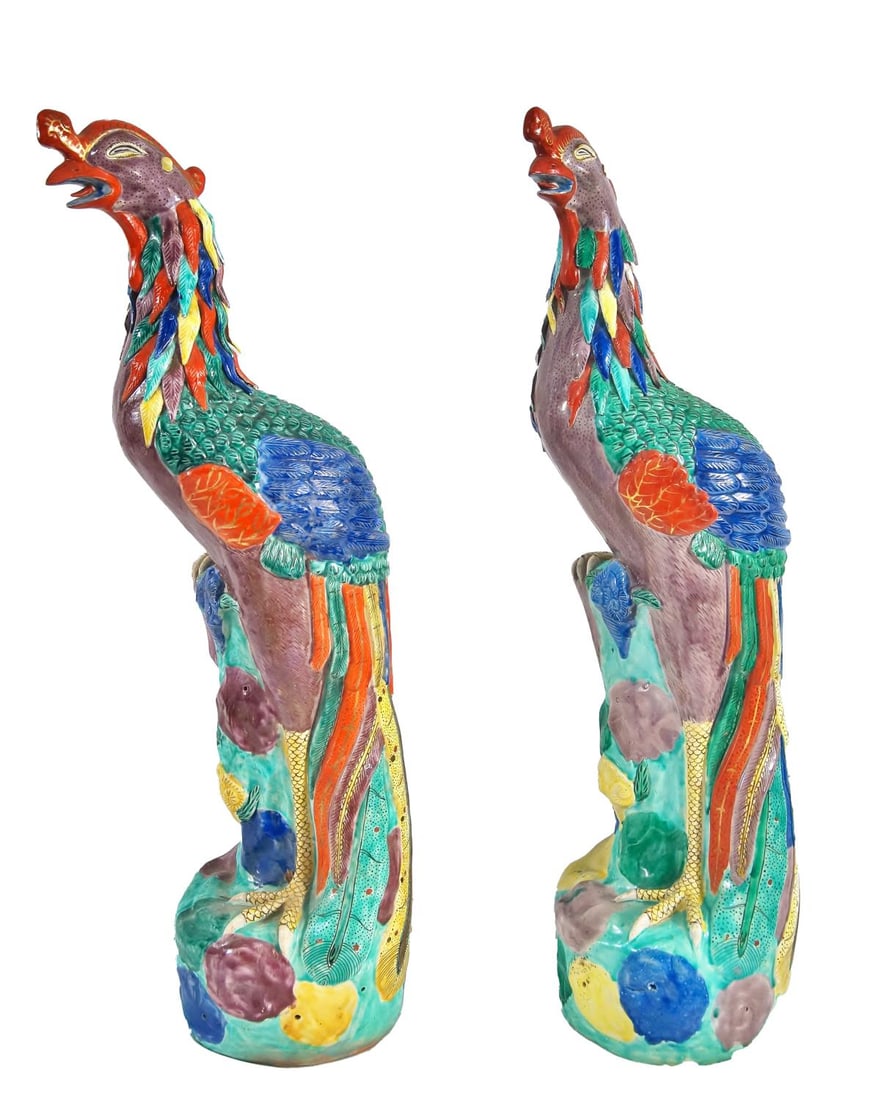 Two Antique Majolica Ceramic Glazed Peacocks: Pair of Majolica Export Porcelain Peacock Birds perched on floral laden rocks in bold Famille Rose enamels, measures approx. 15.5" high