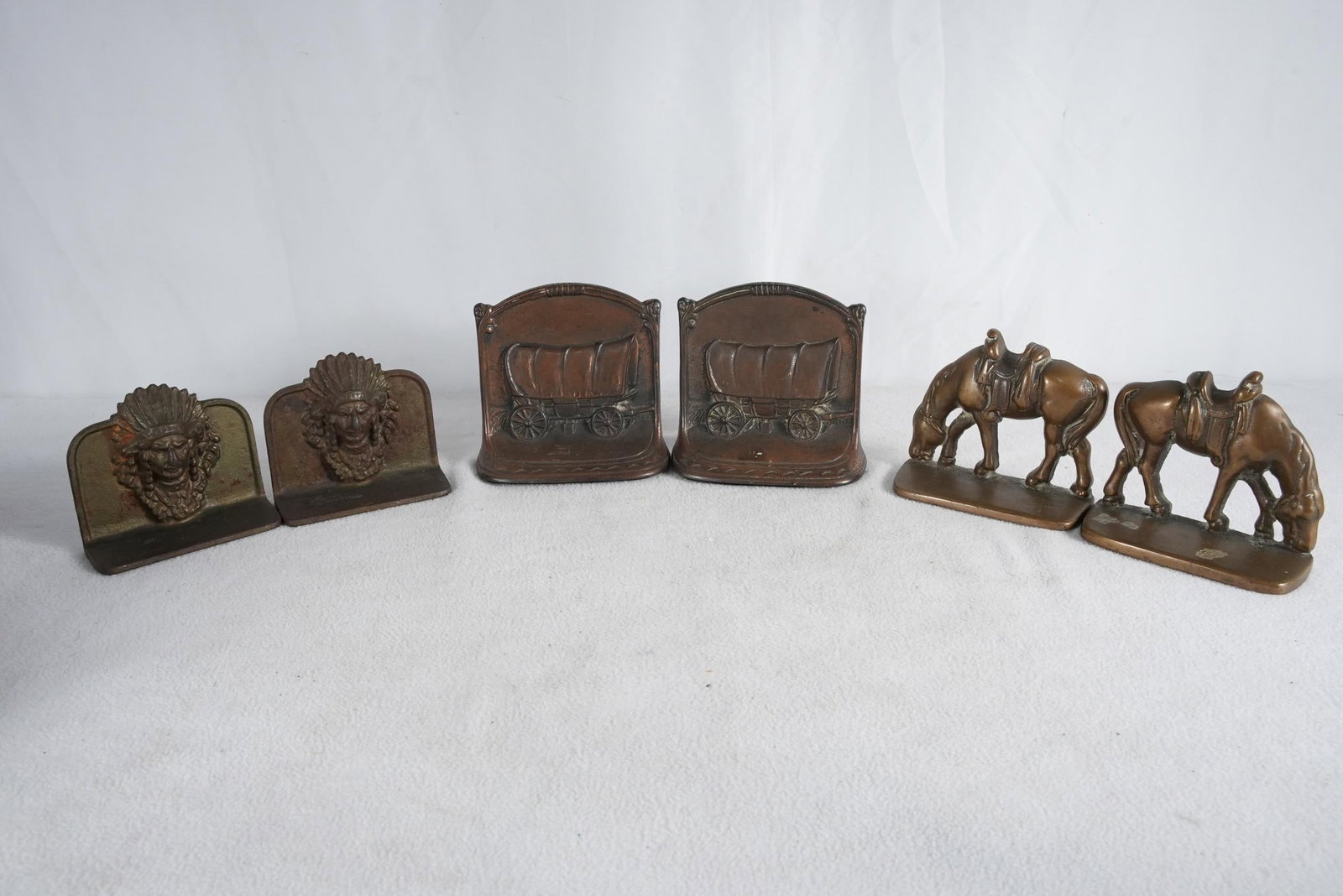 3 Pair of cast iron bookends - Western: Wagon, horse and Indian Chief - largest 5" x 5" x 2.5" Provenance: Museum of the Cowboy "Jim Grimm estate" Solvang Ca.