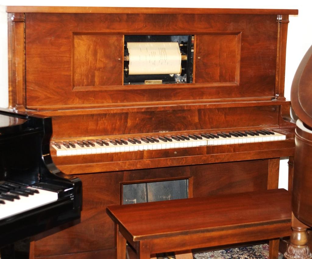 Antique Upright Player piano: with collection of piano rolls, foot pumps, works - rebuild 4- years ago, new bellows - refinished all new tubes, internal work