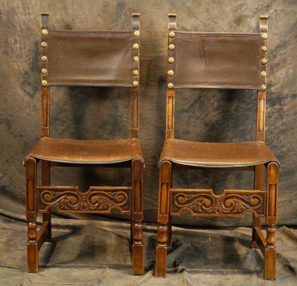 Pair Spanish Colonial carved leather side chairs