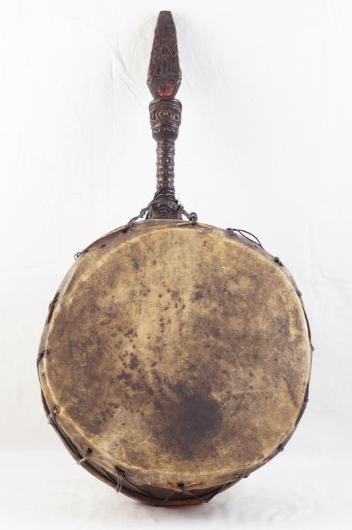 Antique Tibetan Shaman's drum ca 1900: Authentic drum used by the Tamang Tribe Shamans who live in the Himalayan mountains. The carving on the handle is beautifully detailed and ornate. The side of the drum is wood. They used goat skin on 