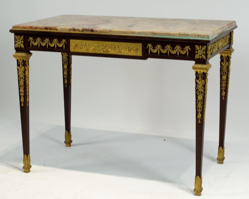 Outstanding Antique French marble top desk: with dore bronze ormolu and cherubic vignettes in relief front and back