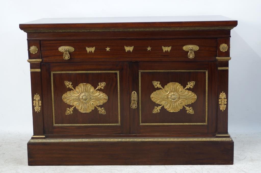 Outstanding Empire Console with bronze butterflies: Heavy Bronze ormolu outline the base and doors, fancy bronze fixtures and hardware and unusual butterfly and star motif. Heavy door lock that fills the length of the door