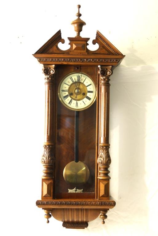Antique German Regulator Wall Clock: enamel face with brass and roman numerals. Two fancy carved columns