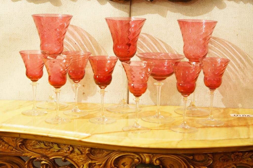 Set of 11 Cranberry glass stems: clear stems swirl cranberry pattern