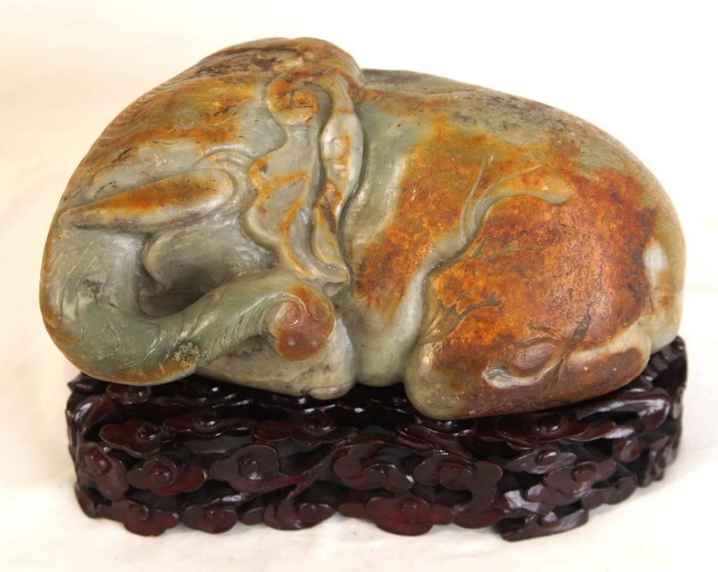 Ming style antique yellow nephrite jade Elephant: One pc Rare and Majestic Ming style antique yellow nephrite jade of an elephant carving with natural and rich russet patches sitting on hard wood stand Qing Dynasty 11" x 5"
