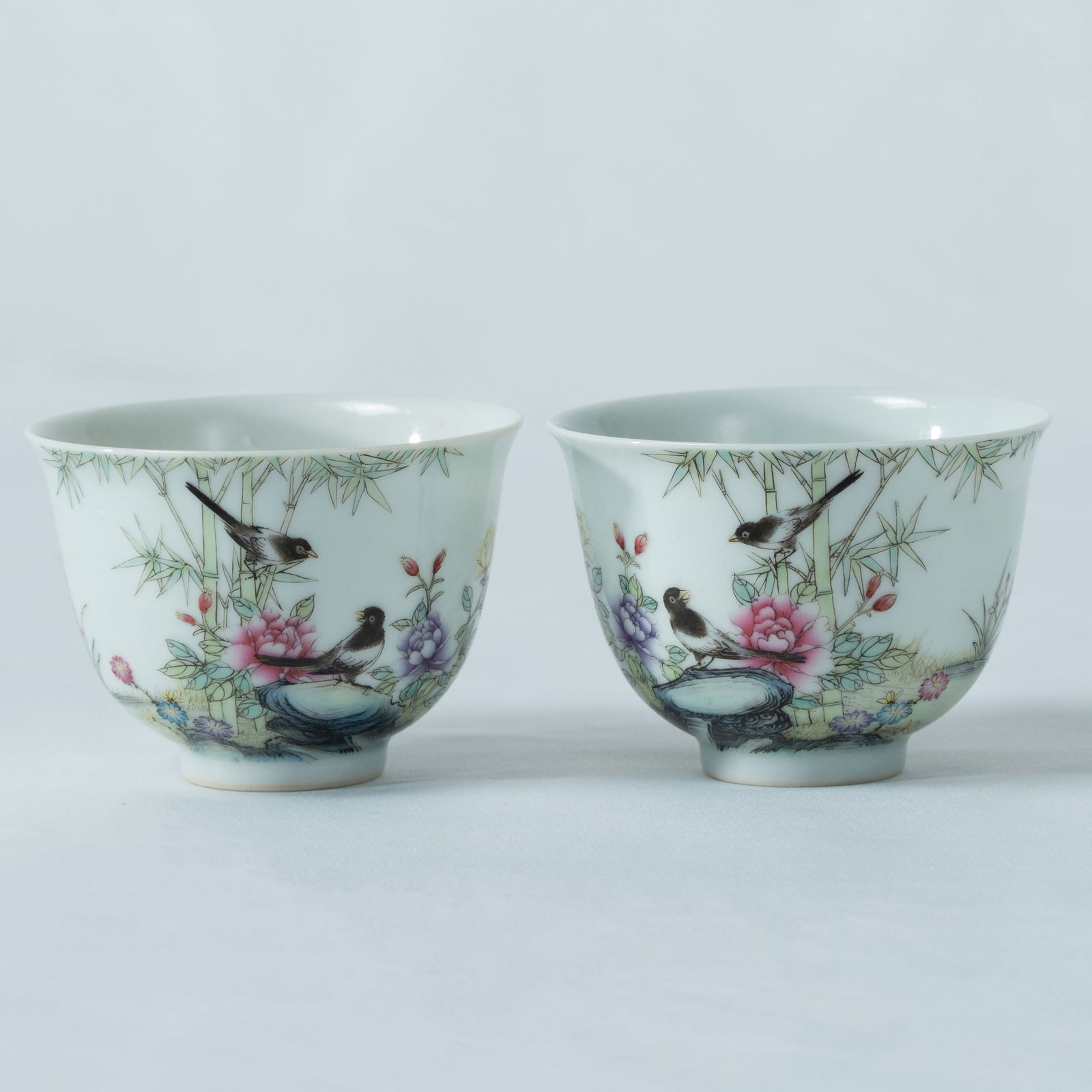A PAIR OF FAMILLE-ROSE 'FLOWERS AND BIRDS' CUPS LATE QING DYNASTY - REPUBLIC PERIOD (1 of 3)