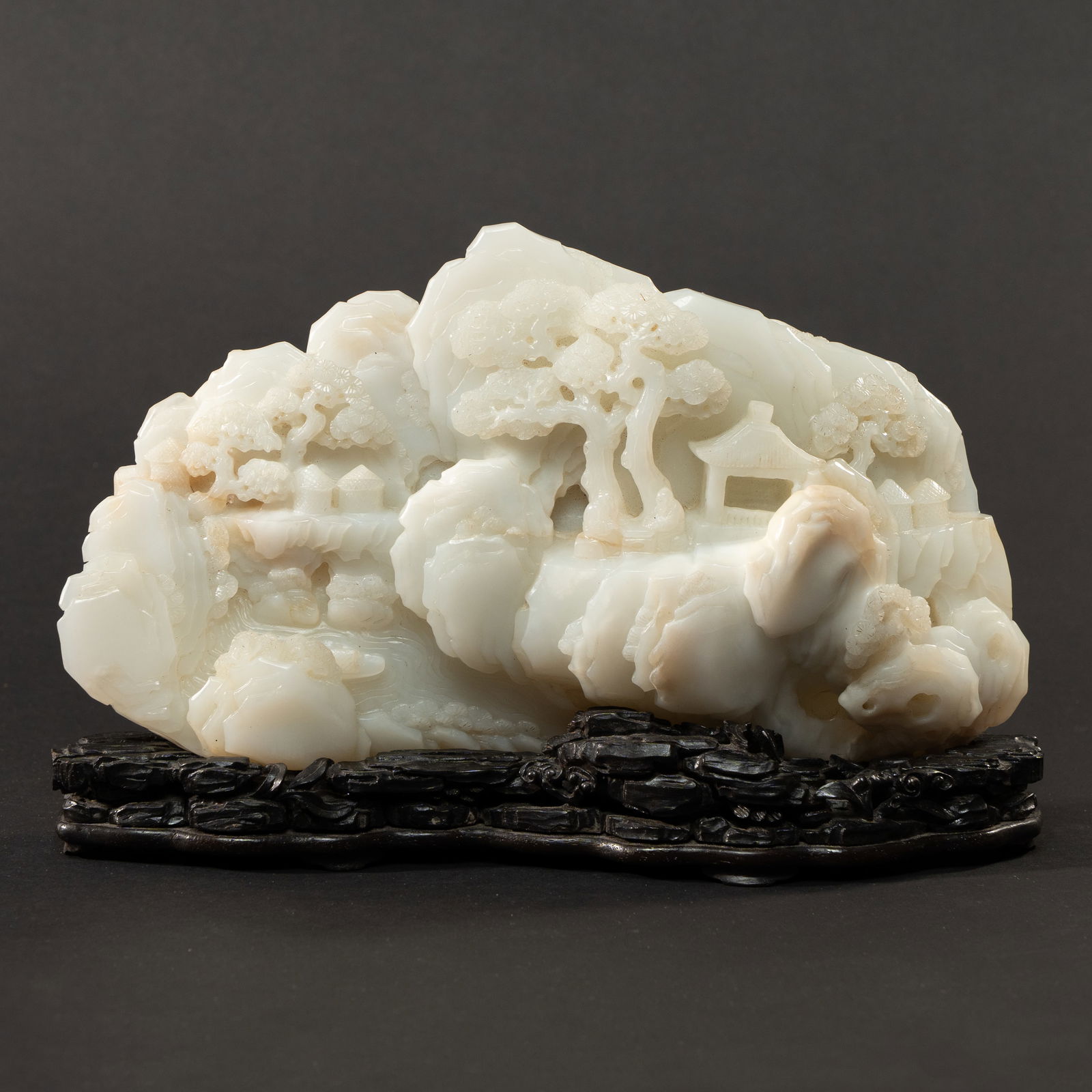 A MAGNIFICENT IMPERIAL WHITE JADE 'VILLAGE CELEBRATION' MOUNTAIN BOULDER QING DYNASTY, 18TH/19TH (1 of 5)