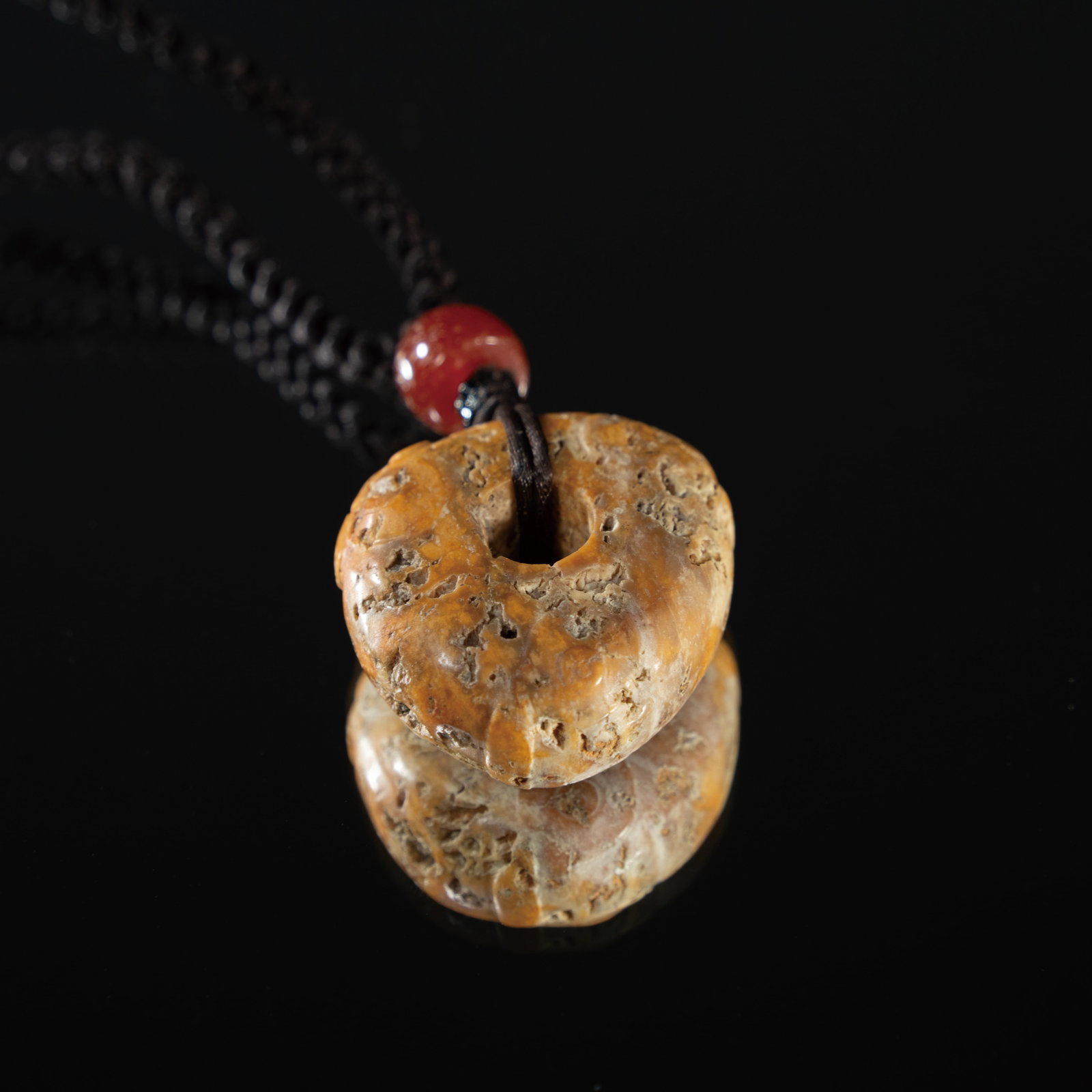 AN ARCHAIC JADE 'DEITY AND BEAST MASK' HEART-SHAPED PENDANT (JIXINPEI) LIANGZHU CULTURE (C. (1 of 3)