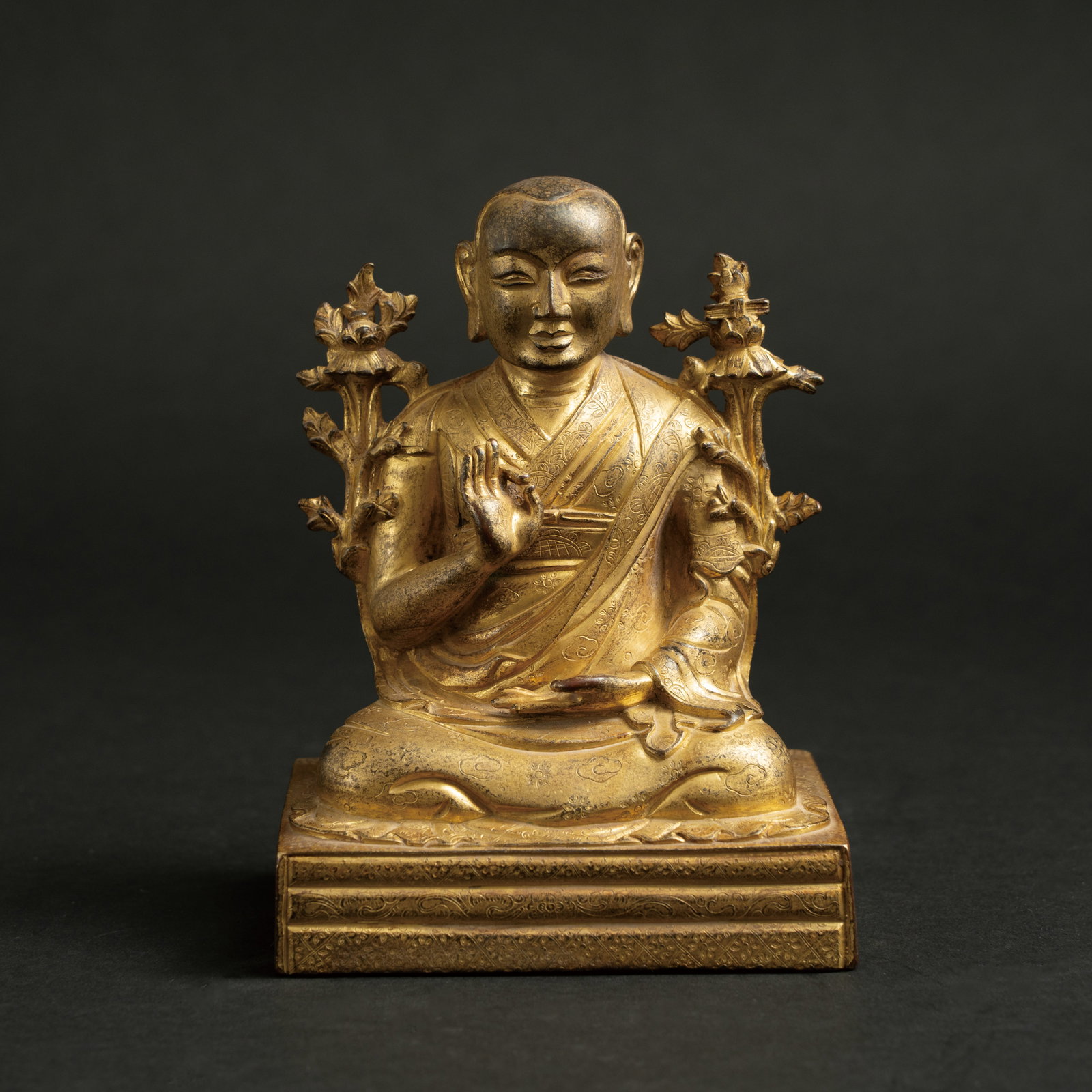 A RARE AND MAGNIFICENT GILT-COPPER ALLOY FIGURE OF A TIBETAN LAMA QING DYNASTY, 18TH CENTURY 清: A RARE AND MAGNIFICENT GILT-COPPER ALLOY FIGURE OF A TIBETAN LAMAQING DYNASTY, 18TH CENTURY清十八世纪 铜鎏金西藏喇嘛坐