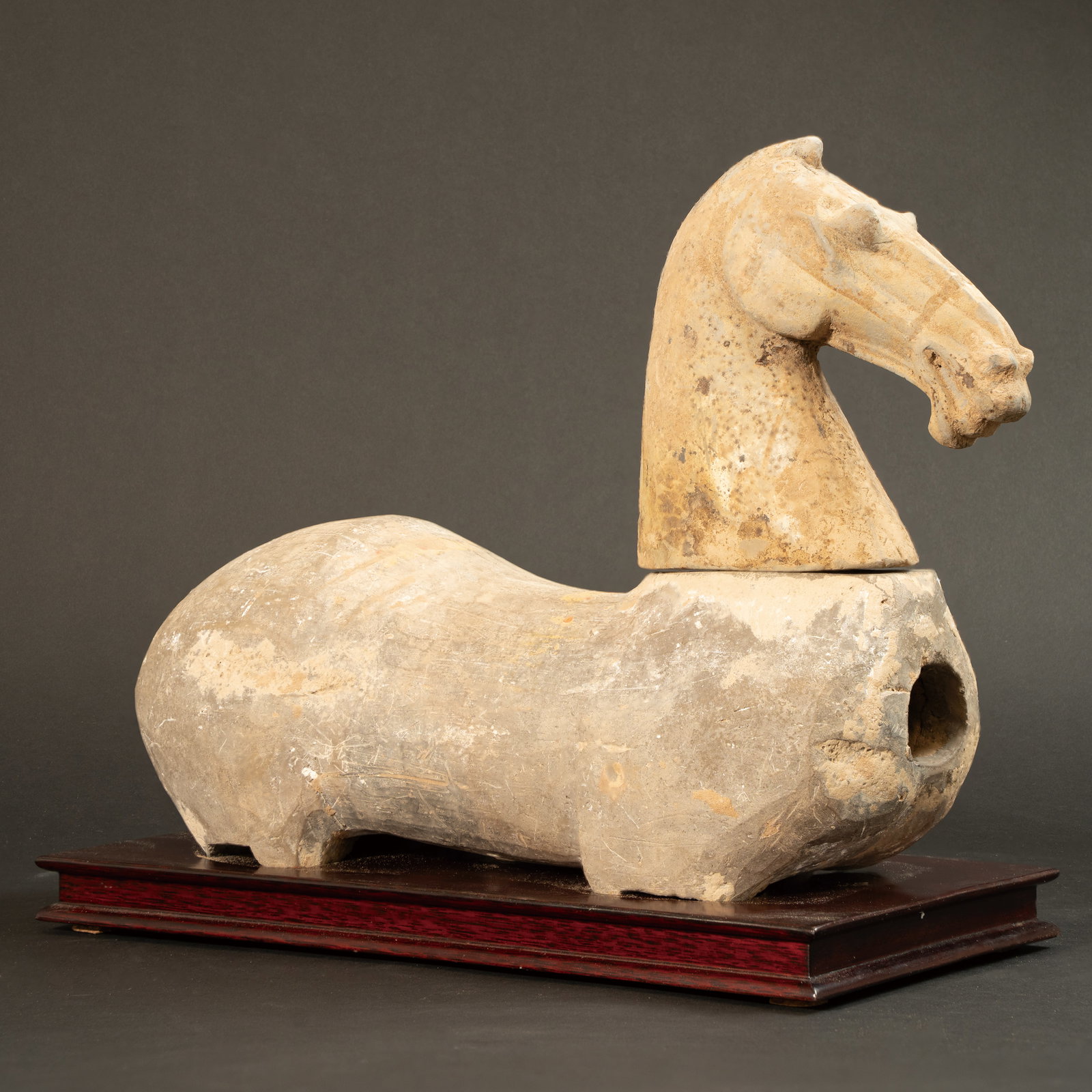 A POTTERY FIGURE OF A RECLINING HORSE HAN DYNASTY (206 BC–AD 220) 汉 陶马 (1 of 10)