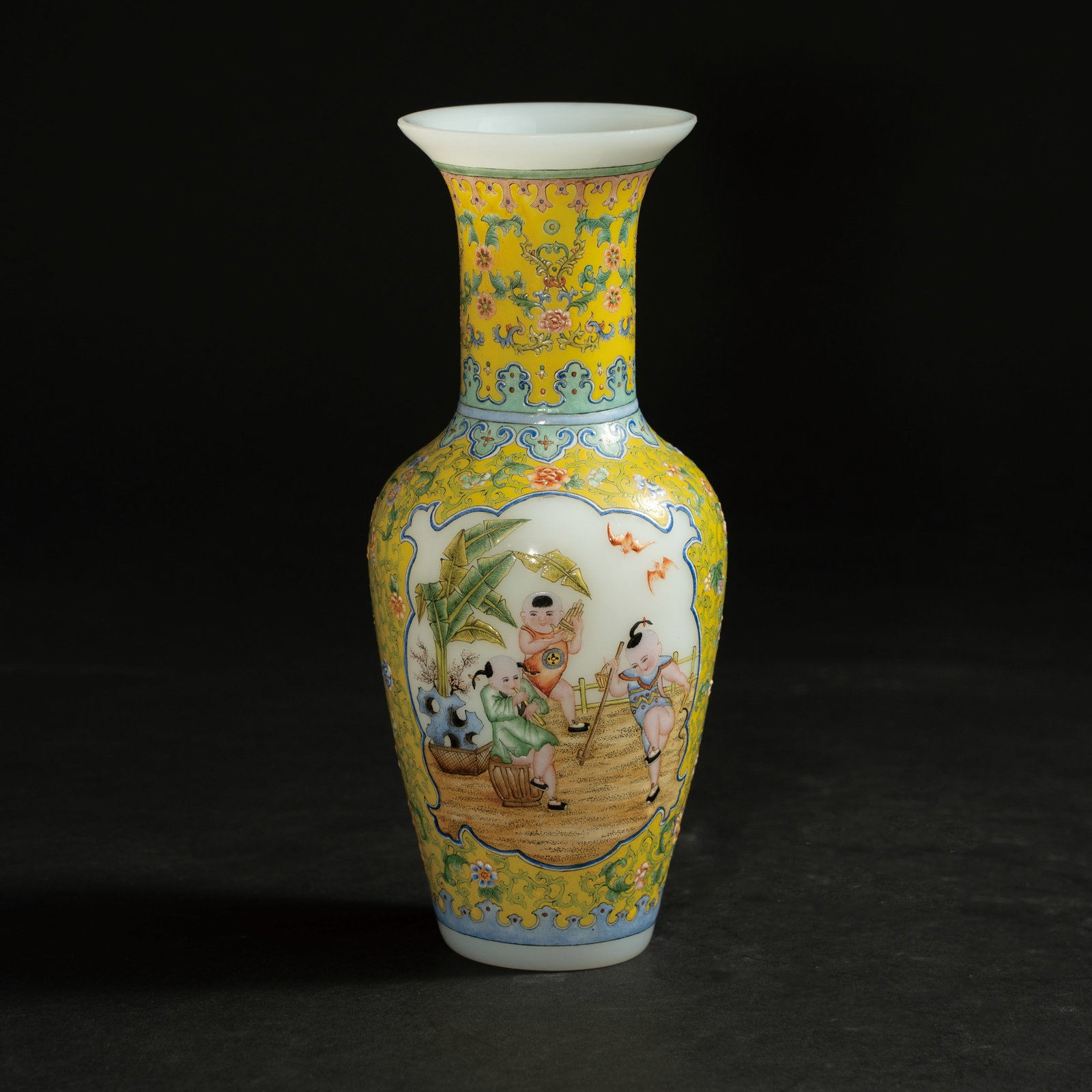 A RARE ENAMEL-PAINTED GLASS 'BOYS AT PLAY' BOTTLE VASE REPUBLIC PERIOD (1912-1949) 民国: A RARE ENAMEL-PAINTED GLASS 'BOYS AT PLAY' BOTTLE VASEREPUBLIC PERIOD (1912-1949)民国 料胎画珐琅开光婴戏图瓶ESTIMATE: $$1.
