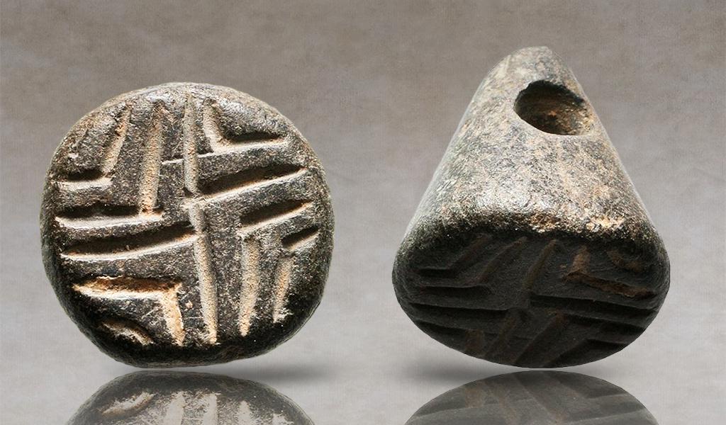 Very Nice Black serpentine stamp seal with swastika device, 4th Millennium BC, Conic shape with: Very Nice Black serpentine stamp seal with swastika device, 4th Millennium BC, Conic shape with horizontal hole, the base with incised lines.(Inventory code: UA4-1)Reference:Condition: Very Fine