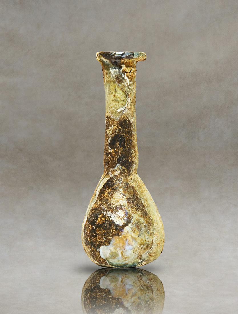 Indulge in the Beauty of Roman Craftsmanship - Intact Translucent Glass Unguentarium: Immerse yourself in the captivating beauty of this intact translucent Roman glass unguentarium, a remarkable testament to the artistry of its era. Adorned with delicate vertical ribs along its pirifor