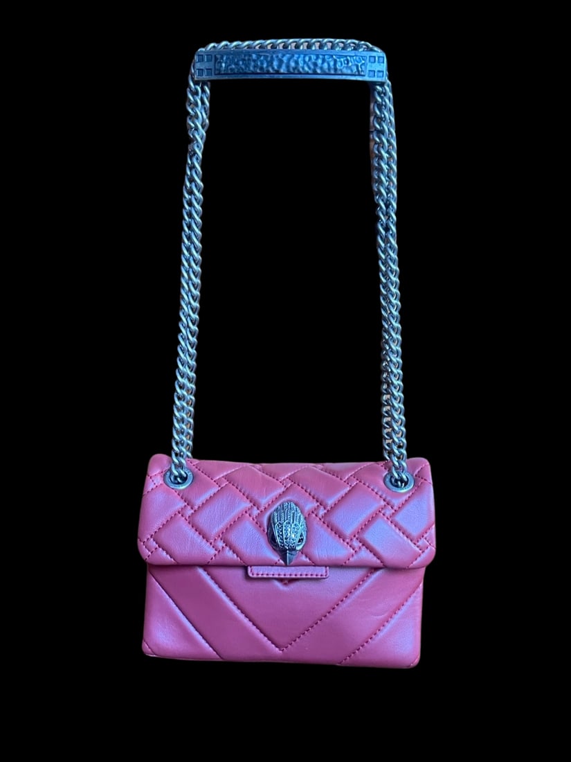 Designer Kurt Geiger Kensington Quilted Leather Crossbody Bag: The Kurt Geiger Kensington Quilted Leather Crossbody Bag is a must-have accessory for any up and coming fashionista. Expertly crafted in London, England, this purse sports it's signature crystal-encru