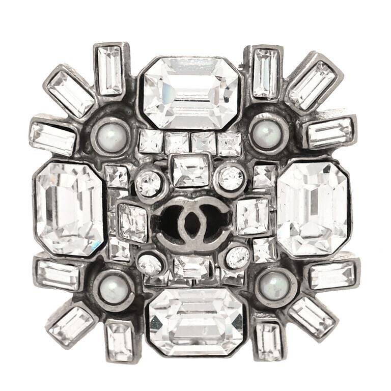 Chanel Crystal Baguette CC Silver Ring: This gorgeous CHANEL Baguette Crystal CC Ring 3.5 in Silver is the perfect piece of timeless style and elegance. Crafted with precision, this ring is made from a shining silver band with a classic CC