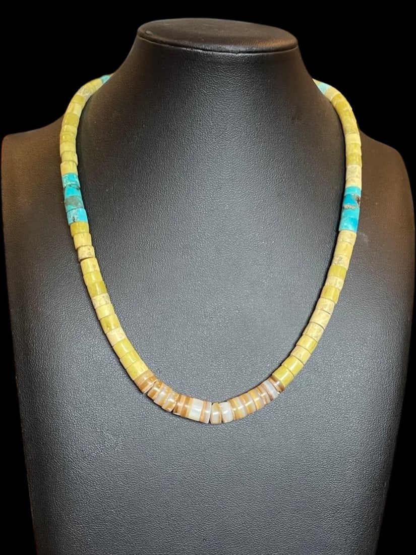 Antique Kingman Turquoise Santo Domingo Heishi Handbeaded Necklace: Add a touch of history and culture to your jewelry collection with this Antique Kingman Turquoise Santo Domingo Heishi Handbeaded Necklace. This necklace is handcrafted by Native American artisans fro