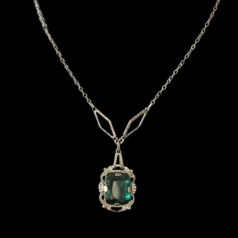 3.00ct Colombian Emerald Antique Pendant Necklace: Delight in the allure of a bygone era with our 3.00ct Colombian Emerald Antique Pendant Necklace. This charming piece hails from the Art Deco period of the early 1920s, a time synonymous with elegance