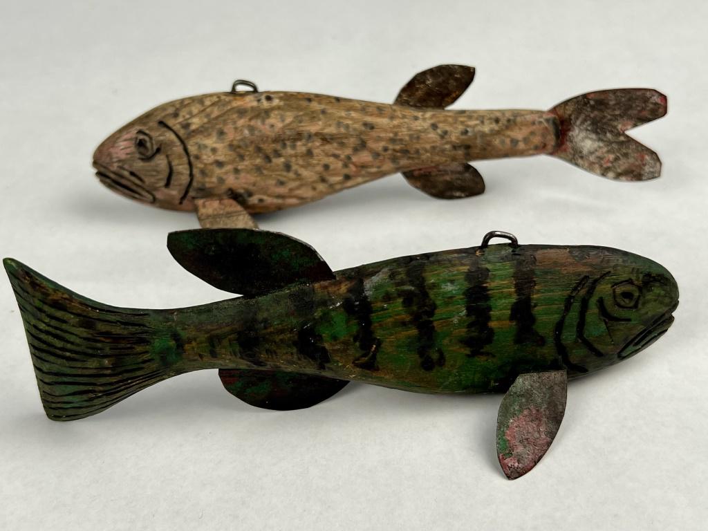 (2) Ice fishing decoys: Carved and painted wood, both signed JLS. Condition: As shown, presenting nicely. Dimensions: L 7" x W 2"