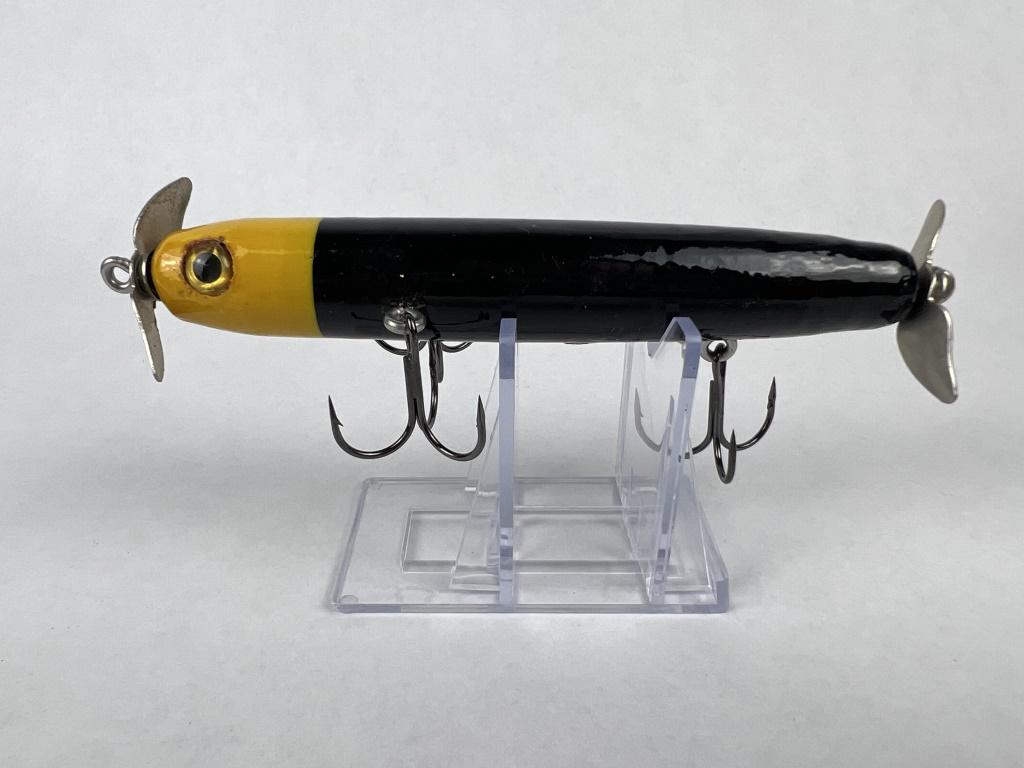 Larry Mayer fishing lure: Larry Miller, Side Stepper Bait Company, painted wood fishing lure, glass eyes. Condition: Discoloration around eyes. Dimensions: L 5.25"
