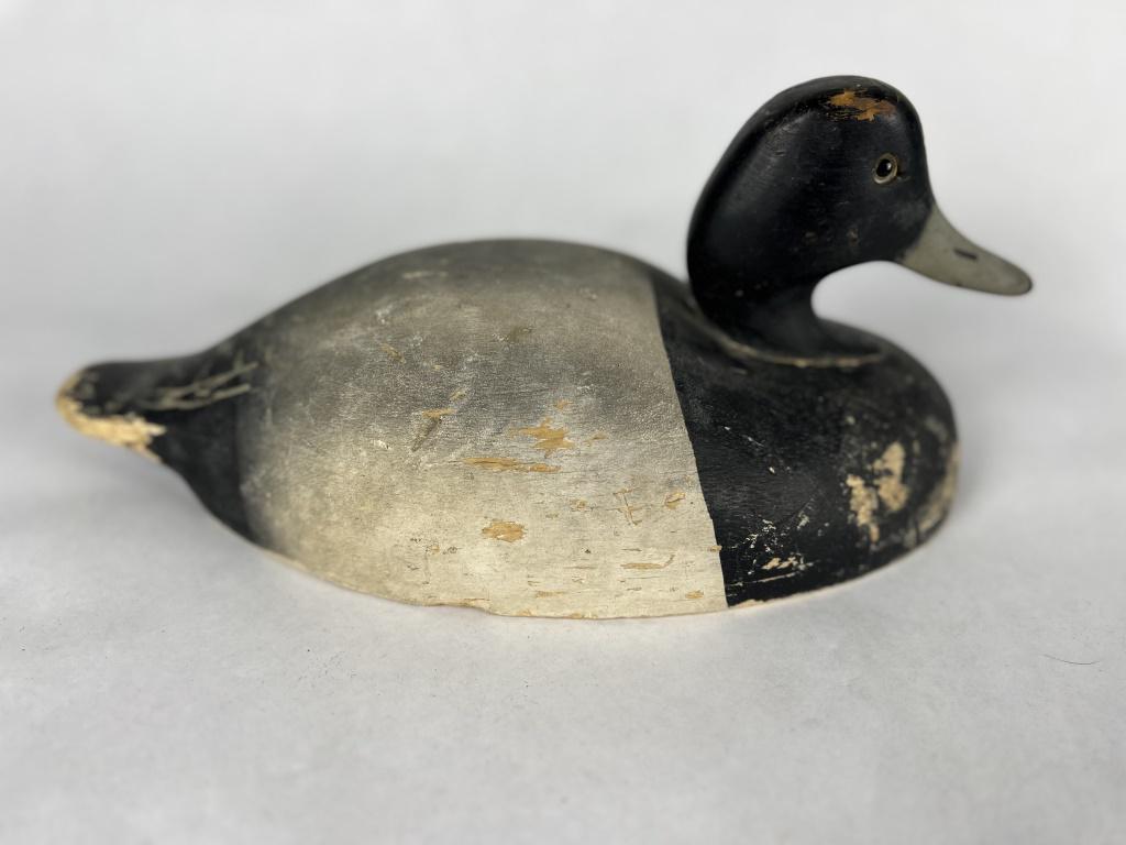 Duck Decoy: Wildflower Decoy Company with branded ARC under. Condition: Scuffs, losses, repair to neck. Dimensions: H 6" x L 13" x W 7"