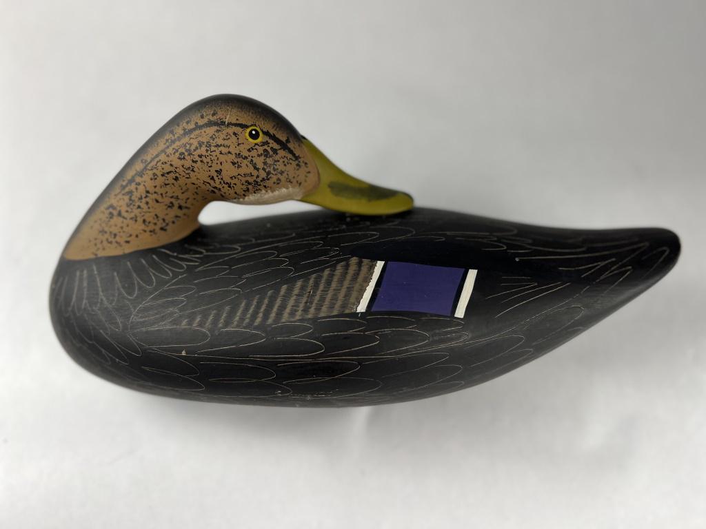 Duck Decoy: Painted wood duck decoy. Signed under Joey Jobes '1987 and JJ 87. Condition: Minor scuffs and marks throughout. Dimensions: L 14" x H 9" x W 7"
