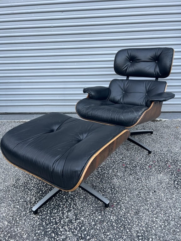 Eames style chair and ottoman: Dimensions: H 34" x W 32" x x D 30" Seat H: 17" Ottoman: H 17" x W 21" L 25" Condition: Minor chipping to wood, some discoloration to wood, scratches to leather, no major rips. Sturdy.