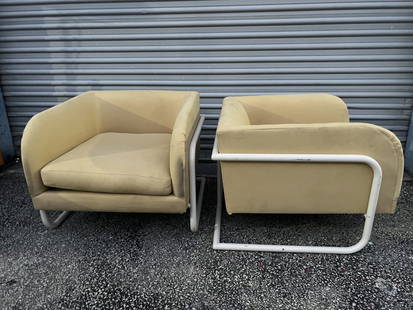 Pair of 1970's tubular chairs: Post modern chairs, no labels. Dimensions: H 25.5" x W 28.5" x Seat H: 15.5" x D 31" Condition: Chips to paint, scattered marks to fabric.