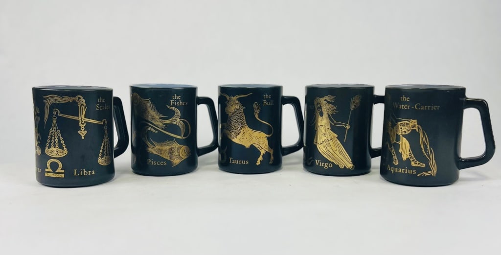 Federal glass black and gold Zodiac cups: (5) mugs. Dimensions: H 4" x W 4" Condition: Minor wear to edges.