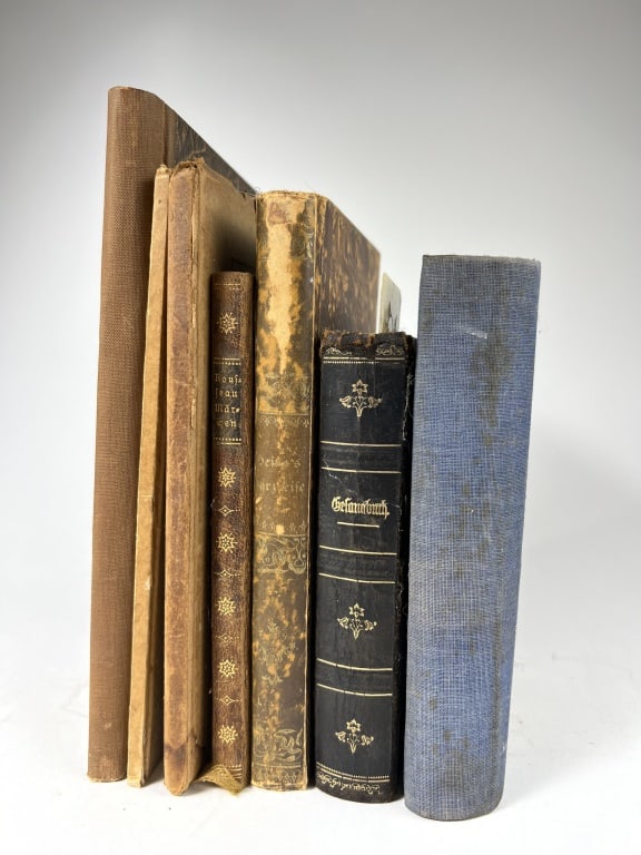 Grouping of 7 antique books (1 of 9)