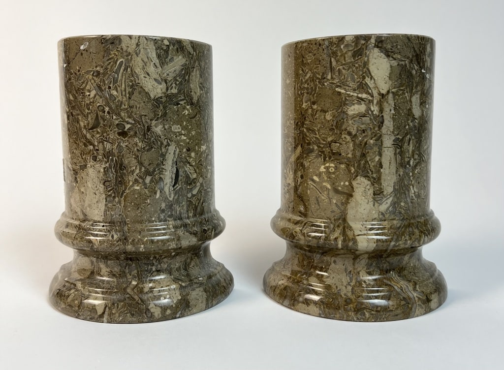 Fossilstone marble bookends: A pair of fossilstone marble bookends. Dimensions: H 7" x W 5" x D 2.25" Condition: Nicely repaired cracks to corners.