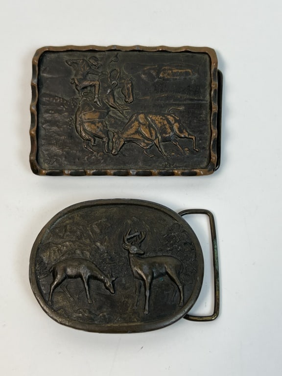 (2) Vintage brass belt buckles: The smaller marked Indiana Metal craft. Dimensions: Larger: L 3.25" Condition: Tarnished, usable.