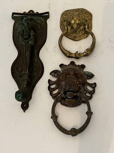 (3) Brass/Bronze lion door knockers: Three older door knockers. Dimensions: Larger: H 10" x W 3.75" Condition: Tarnish. 242