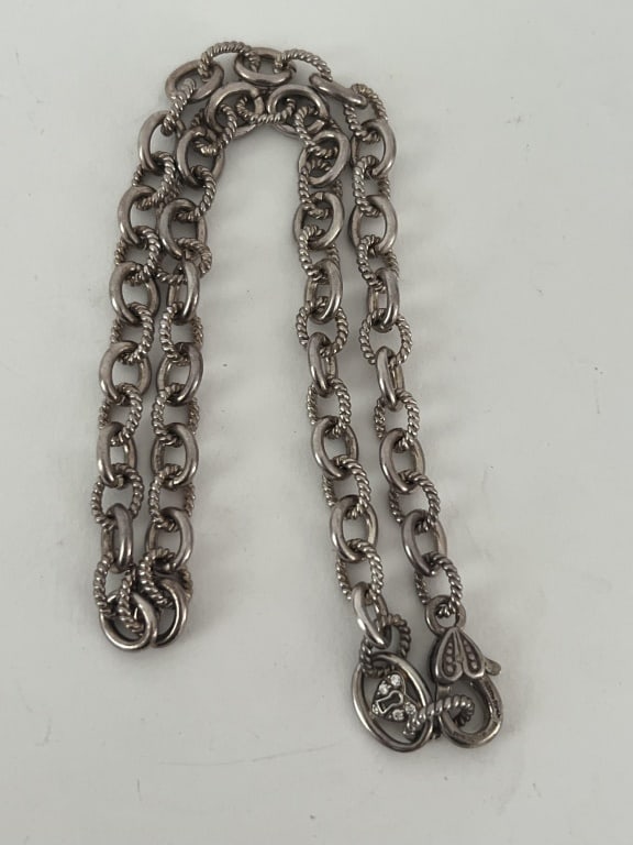 Judith Ripka sterling silver necklace: Hallmarked sterling silver necklace by Judith Ripka. Measuring 18' long Weight: 48 grams Condition: Good, used.