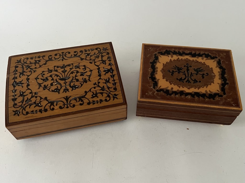 (2) Marquetry inlaid music boxes: The smaller a Swiss Reuge box and the larger a Swiss Premix box. Dimensions: Larger: L 6.25" x W 4.75" x H 2.25" Condition: Both working and showing normal signs of age