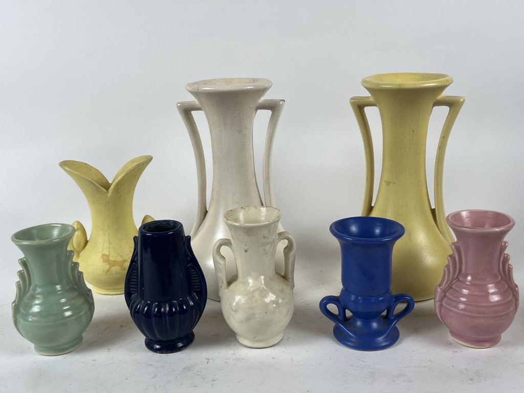(8) McCoy style including mini vases: None marked McCoy, some marked USA. Dimensions: Pair of Large: H 9.25" x W 6" Smaller: H 4.5". Condition: Crazing throughout.