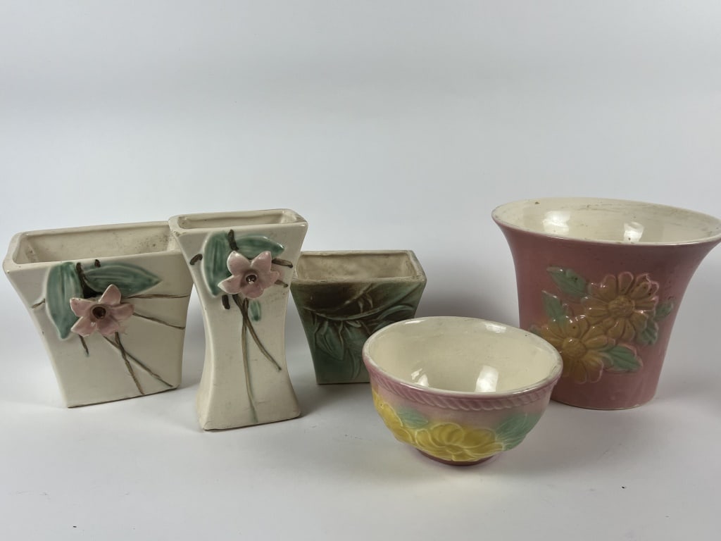 Grouping of McCoy floral vases and planters (1 of 10)