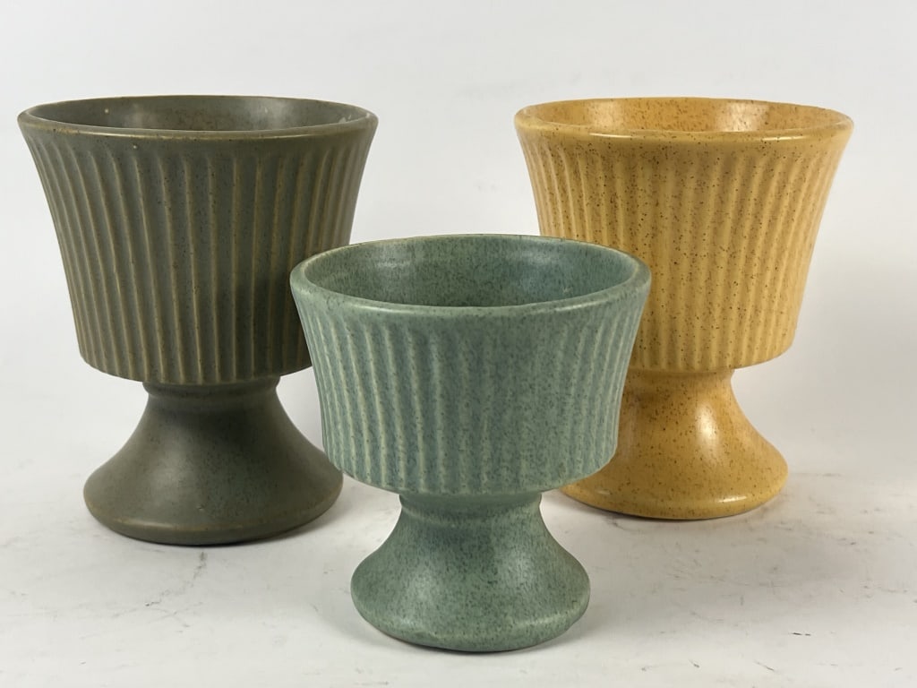 (3) McCoy Floraline fluted pedestal planers: Dimensions: Tallest: H 6" x Dia: 5" Condition: Presenting nicely.