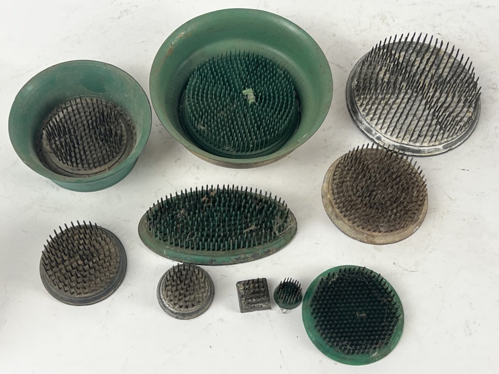 Grouping of metal flower frogs (1 of 2)