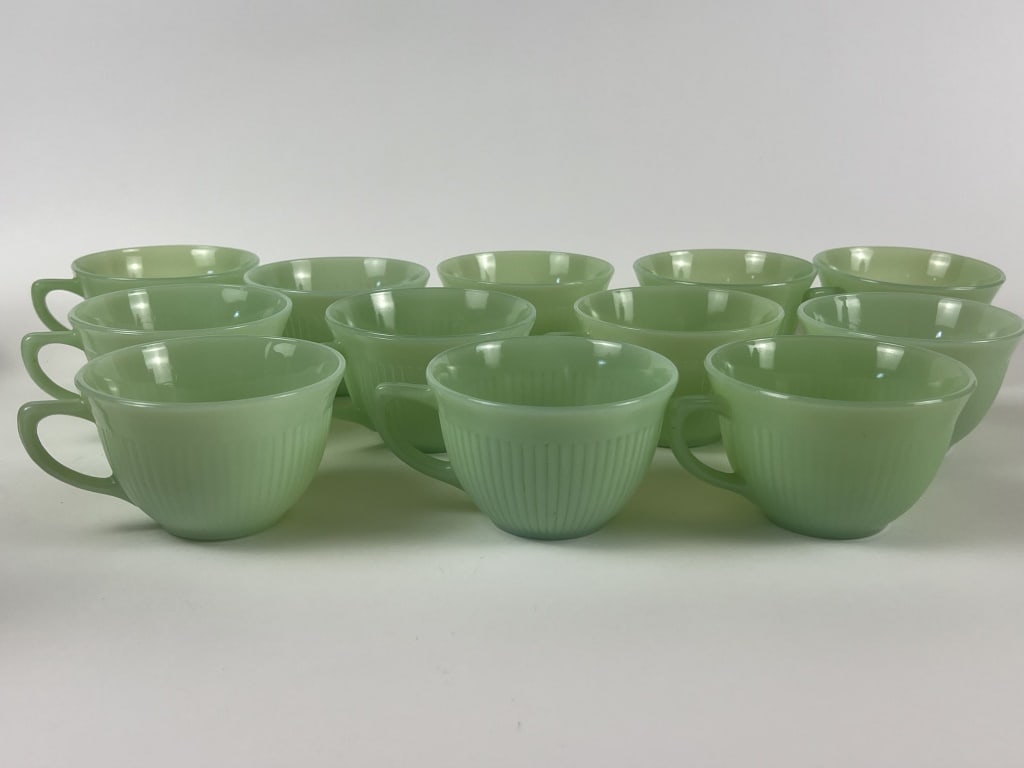 (12) Fire-King Jadeite cups: Diameter: 3.75" Condition: Presenting nicely.